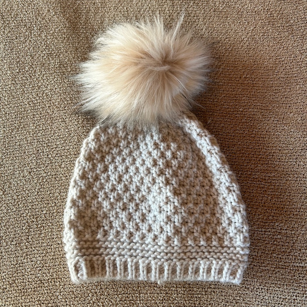 Winter hat with faux fur pom